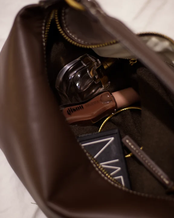 Gisou lip oil in a brown bag